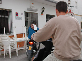 Boys riding bikes in Calle San Jose, Conil de la Frontera