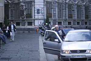 Man entering a car at Piazza Fontane Marose, Genova