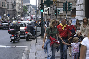 Family on crowded Via XX Settembre, Genoa
