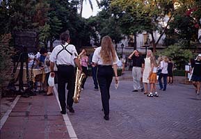 Musicians heading towards restaurants quarter, Marbella