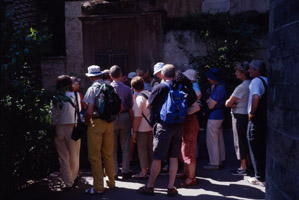 British guide explains something to a group of British tourists outside Chiesa  S. M. dell' Ammiraglio (o Martorana), Palermo