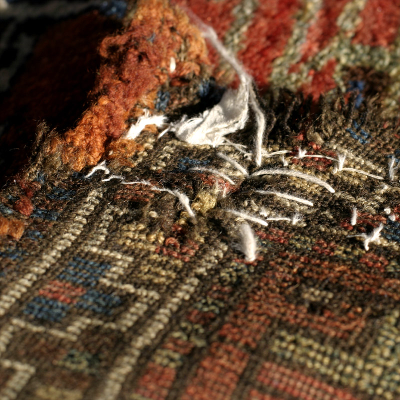 Anatolian village rug - corner with stitched repair