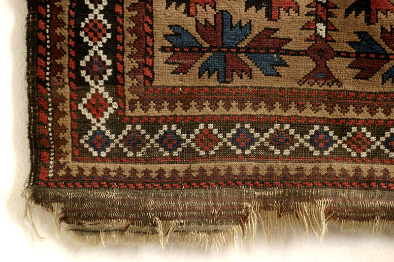 Baluch tree of life rug, bottom-left corner