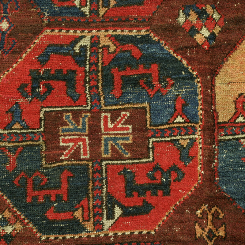 Karakalpak or Uzbek main rug - red and blue Kalkan nuska gul, animals with ramshorn type tails