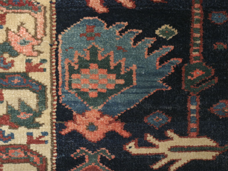 Antique north-west Persian Kurdish Palmette rug: palmette wih blue abrash near edge