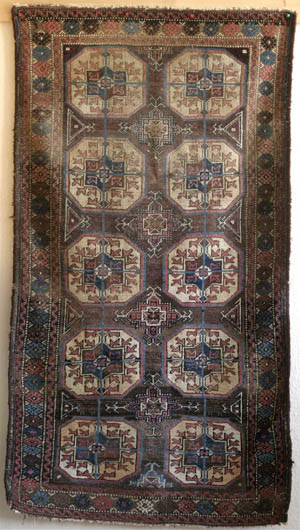 Antique Sistan? Baluch rug with Turkmen Tekke guls, ca. 1900.—click to see enlarged view